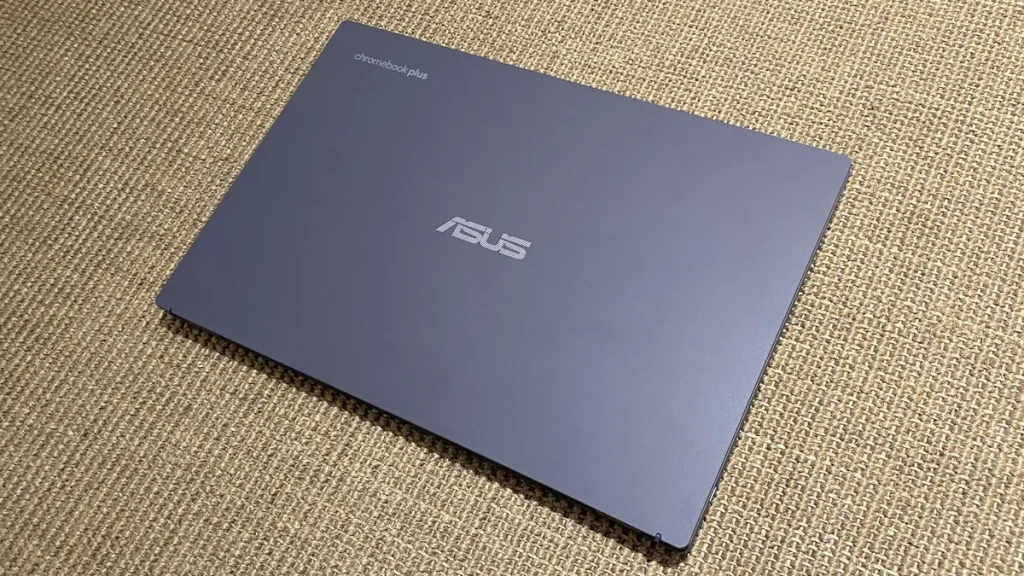 Asus Chromebook Plus CX34 (CX3402CBA-DH386-WH) Laptop placed on a carpet